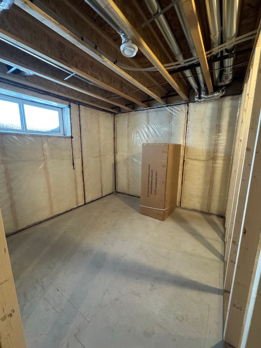 Basement insulation and ductwork before suite construction