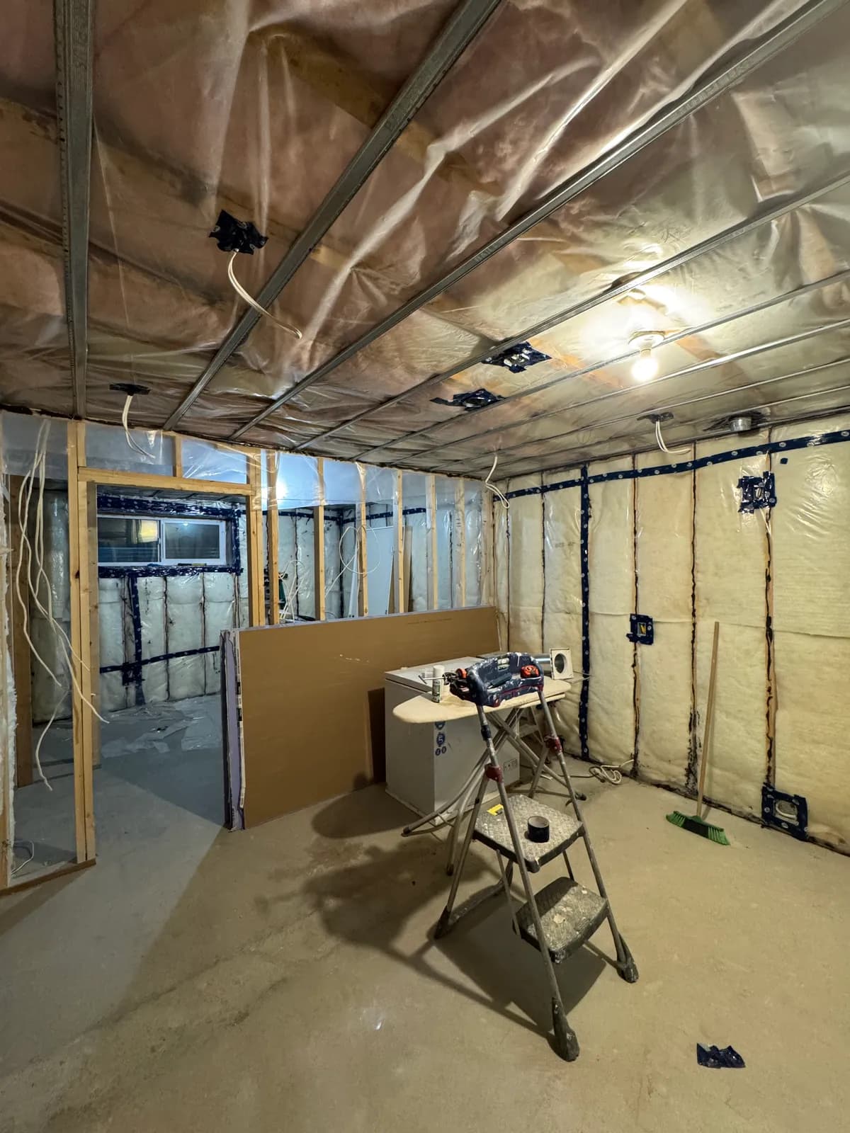 Interior framing with insulation and electrical rough-in before finishing