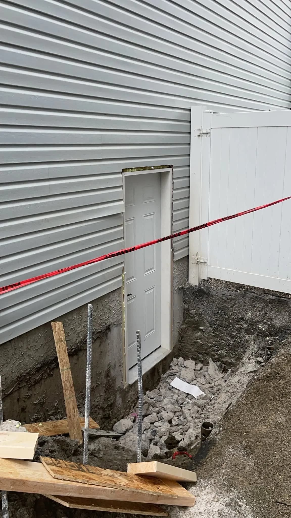 New separate side entrance cut into foundation, designed and permitted in-house