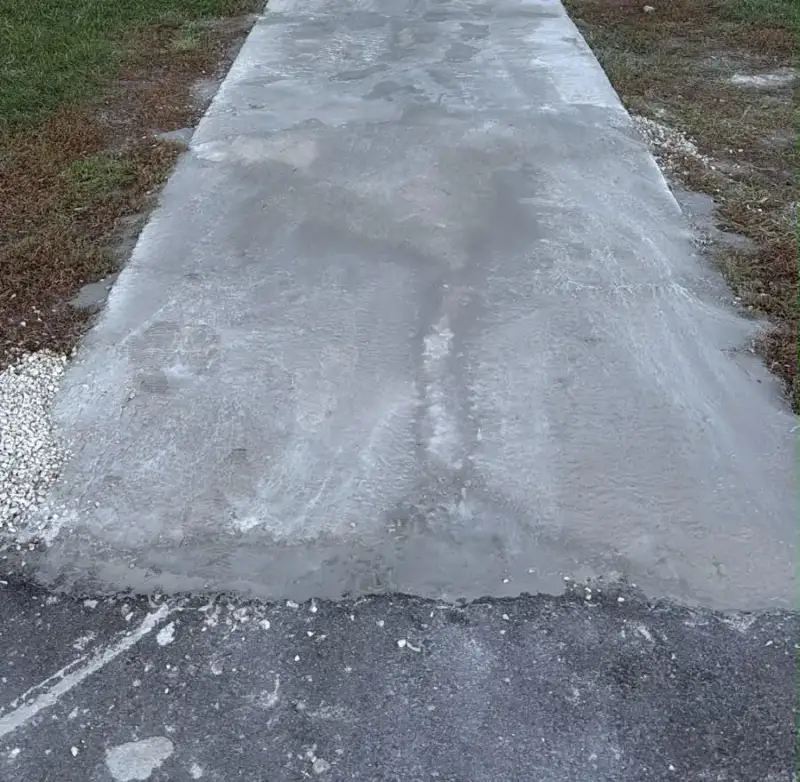 Finished concrete entrance walk after replacement at a Saskatoon rental building