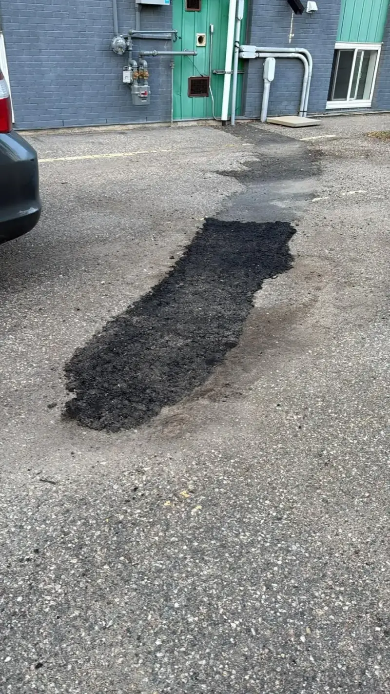 Full-depth hot-mix asphalt patch in an apartment parking lot